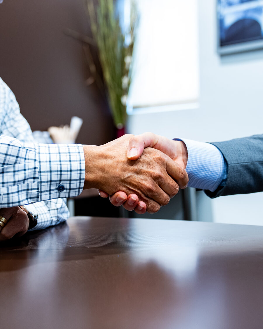 Javier Sanchez, CPA, shaking hands with a client after a consulting session