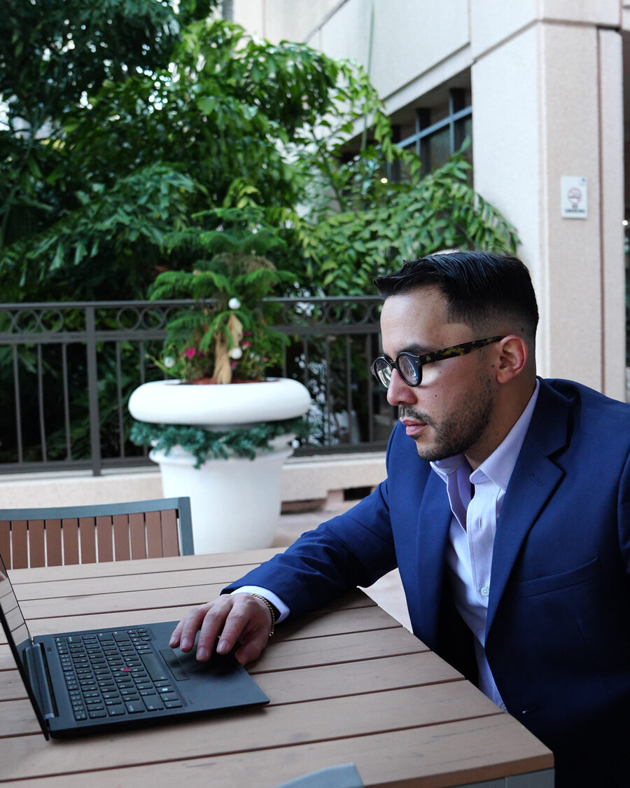 Javier Sanchez, CPA, preparing taxes on a laptop in South Florida